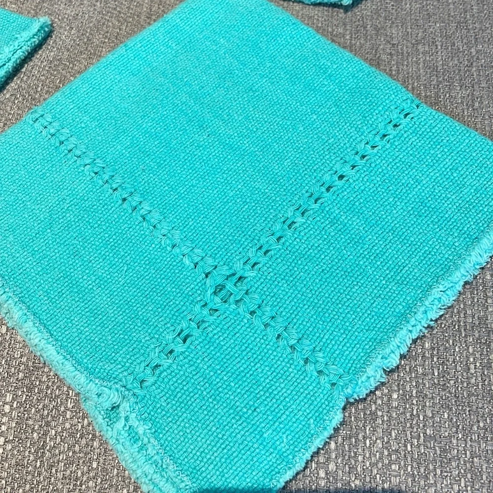 Set of 4 cotton raw edge napkins.